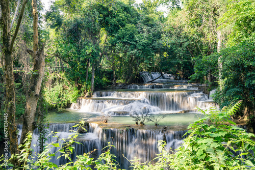 Beautiful Jungle waterfall in tropical rainforest in Thailand. © black_J