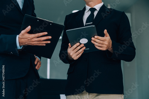 Entrepreneurs and business people conference in modern meeting room, happy multiracial coworkers have fun cooperating working together at office meeting, asian teamwork concept