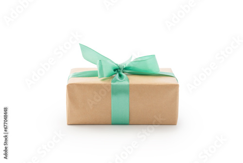 Brown paper gift box with green ribbon isolated on white
