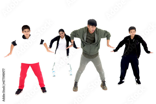 Group of happy kids studying modern style dance in indoor studio classroom with their teacher, children and adult dancing white background. Dance teacher teaching and practicing dance with students.
