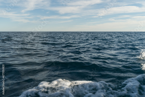 Sea travelling background of empty horizon with sunny weather © GCapture