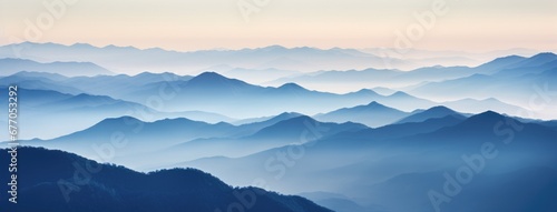 A Majestic Panorama of Towering Mountain Peaks in the Distance © pham