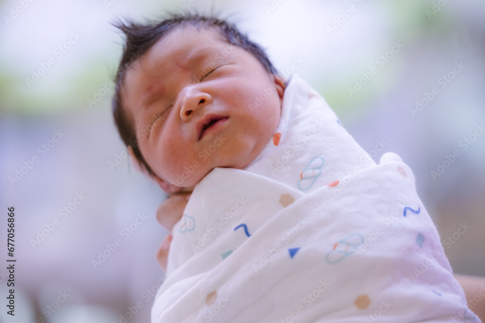 Baby boy was just born with Baby cloth wrapped around the whole body.