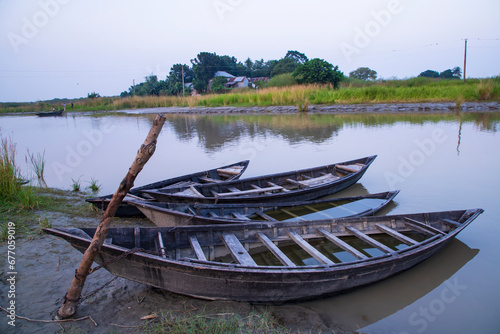 landscape view of Traditional wooden fishing boats on the shore of the Padma River in Bangladesh