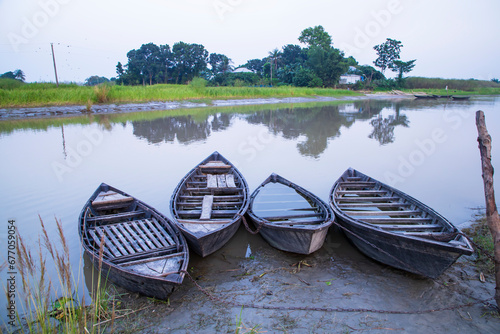 landscape view of Traditional wooden fishing boats on the shore of the Padma River in Bangladesh