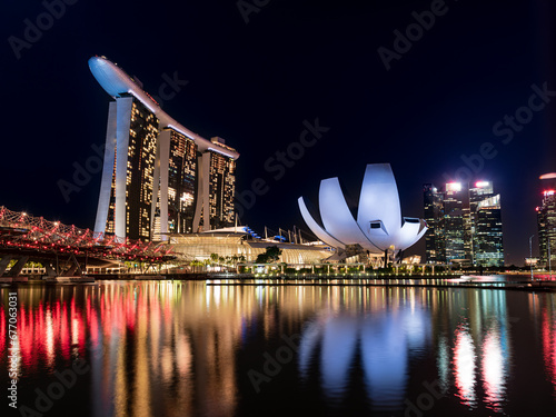 SINGAPORE - 2022 July : Night view at Marina Bay Sands Resort complex in Singapore. Luxury hotel and most expensive in world standalone casino property is main tourist attraction at 