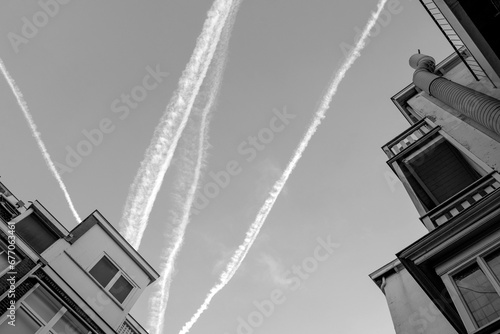 black white sky smog trace roof top plane house flight pollution Netherland