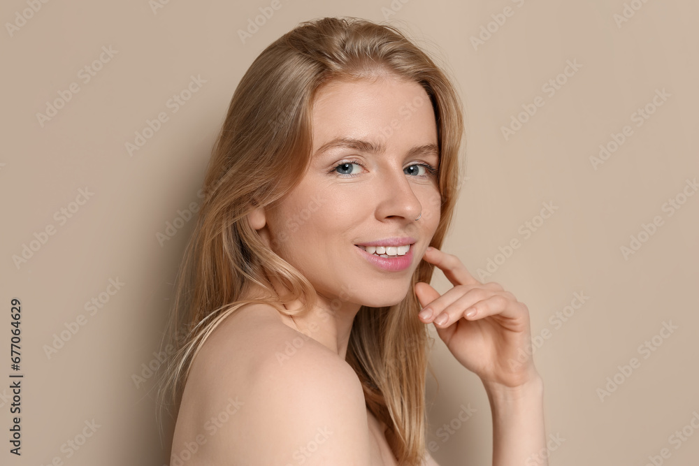 Portrait of beautiful young woman on beige background Portrait of beautiful young woman on beige background