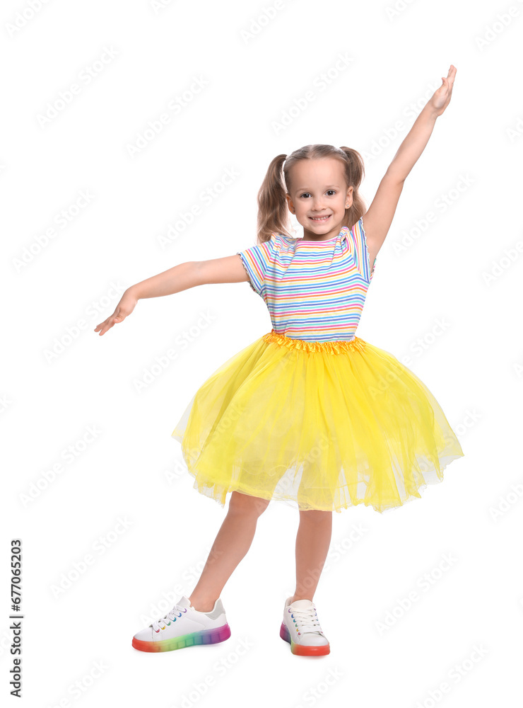 Fototapeta premium Cute little girl in tutu skirt dancing on white background