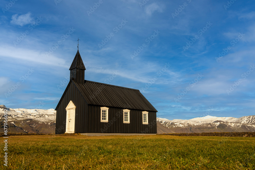 Budir Black Church, better known as the Black Church. Shot close up at ground level capturing the stone wall and mountain background