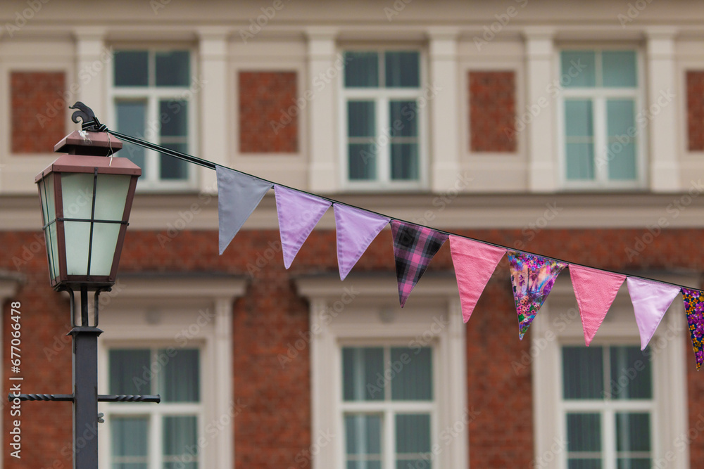 Bright festive garlands. Festive garlands in the form of flags. Bright multicolored flags. Garlands of ribbons. Bright festive garlands. Festive garlands in the form of flags. Bright multicolored flags. Garlands of ribbons.