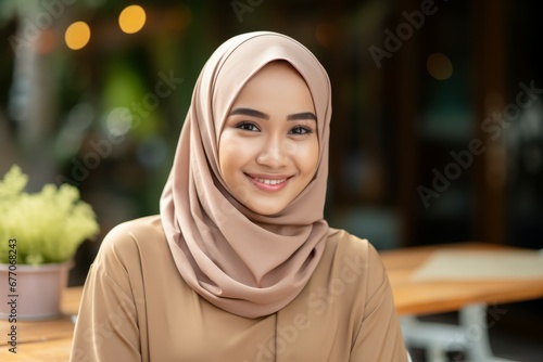 an indonesia young woman smile at camera photo