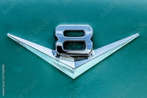 V8 emblem of an american oldtimer vintage muscle car.