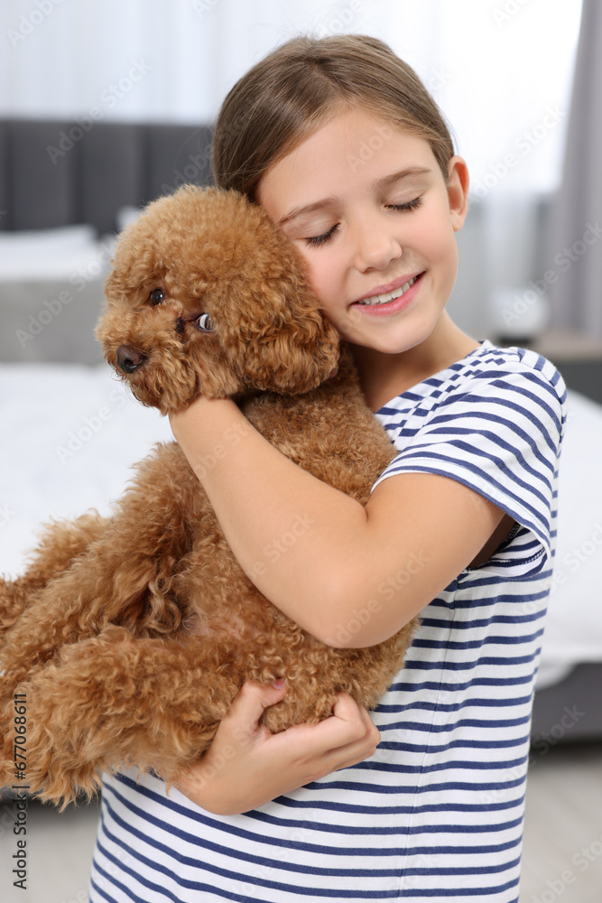 Little child with cute puppy at home. Lovely pet Little child with cute puppy at home. Lovely pet