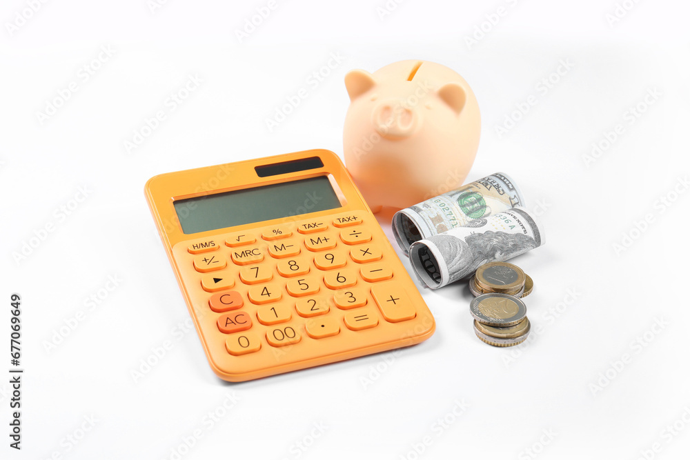 Calculator, piggy bank and money on white background. Retirement concept Calculator, piggy bank and money on white background. Retirement concept