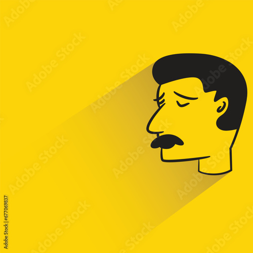 sad man with shadow on yellow background