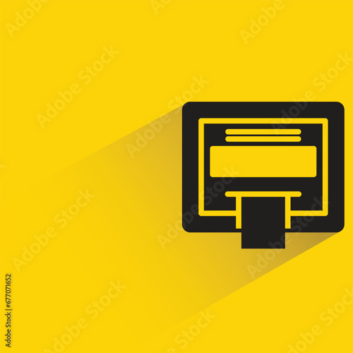 atm with shadow on yellow background