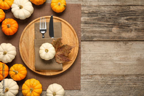 Autumn table setting, pumpkins and dry leaf, flat lay. Space for text
