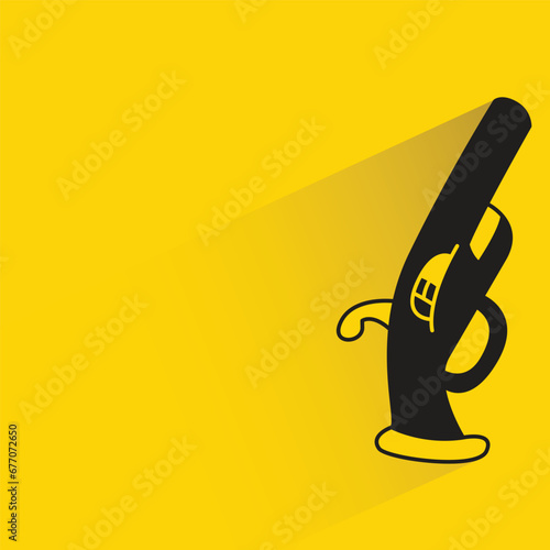shotgun with shadow on yellow background