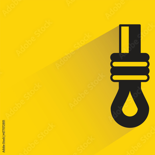 hanging rope with shadow on yellow background