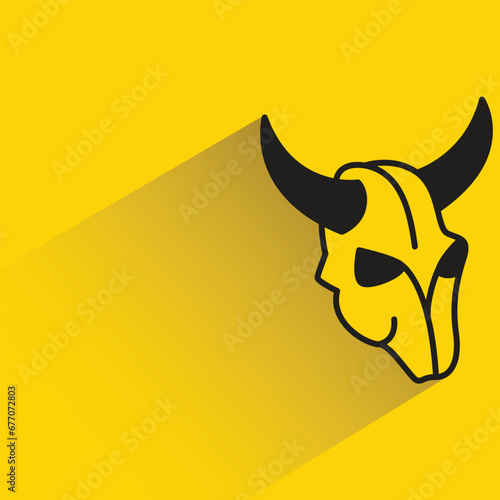 ox head with shadow on yellow background