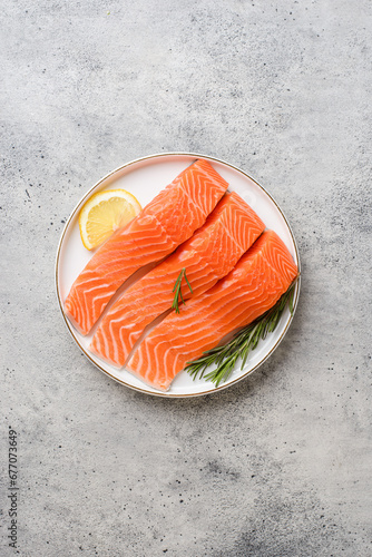 raw salmon on a gray background in a plate