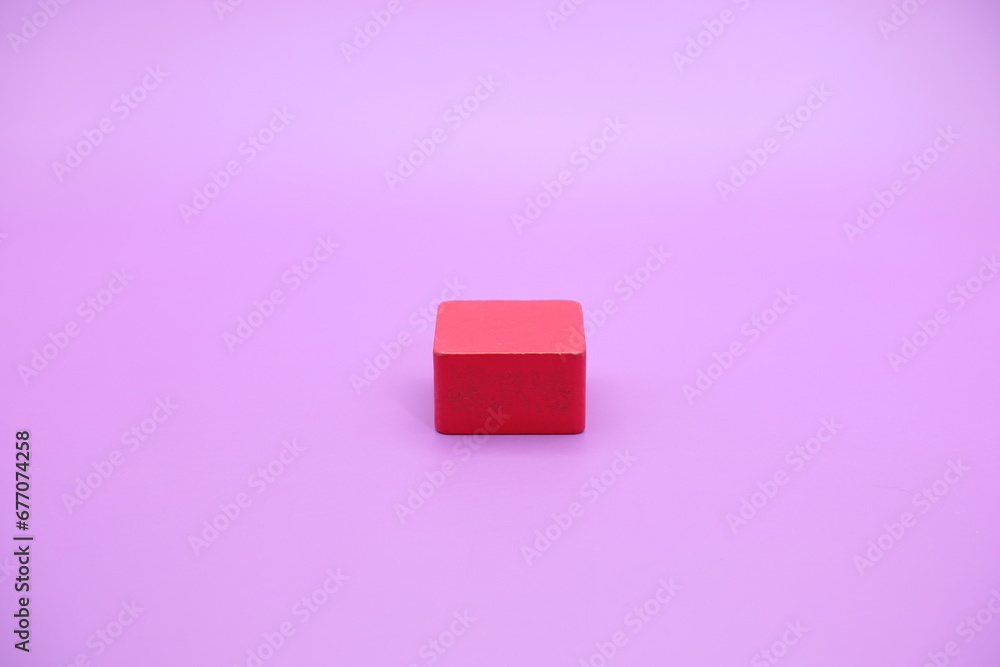 red wooden shape toy. Rectangle on Purple background red wooden shape toy. Rectangle on Purple background