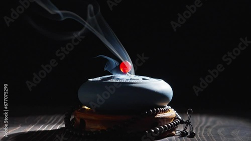 incense burner censer with smoke on black background.	 photo