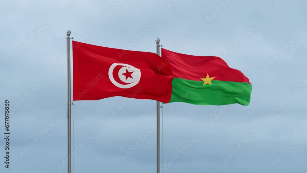 Burkina Faso flag and Tunisia flag waving together on cloudy sky, endless seamless loop, two country relations concept Burkina Faso flag and Tunisia flag waving together on cloudy sky, endless seamless loop, two country relations concept