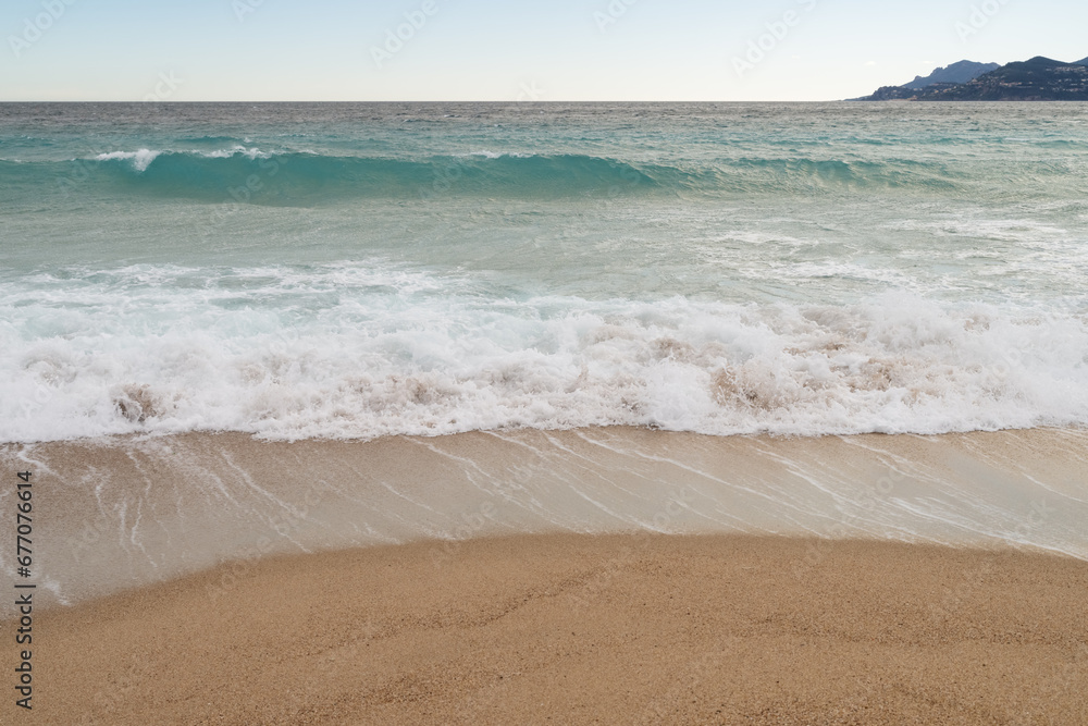 Sand beach of South France during spring with sea waves