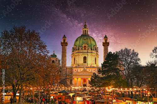 Christmas market on Karlsplatz in Vienna at night holiday season photo