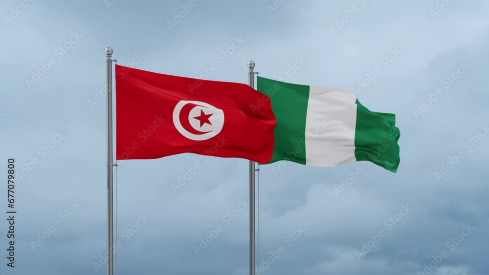 Nigeria flag and Tunisia flag waving together on cloudy sky, endless seamless loop, two country relations concept Nigeria flag and Tunisia flag waving together on cloudy sky, endless seamless loop, two country relations concept