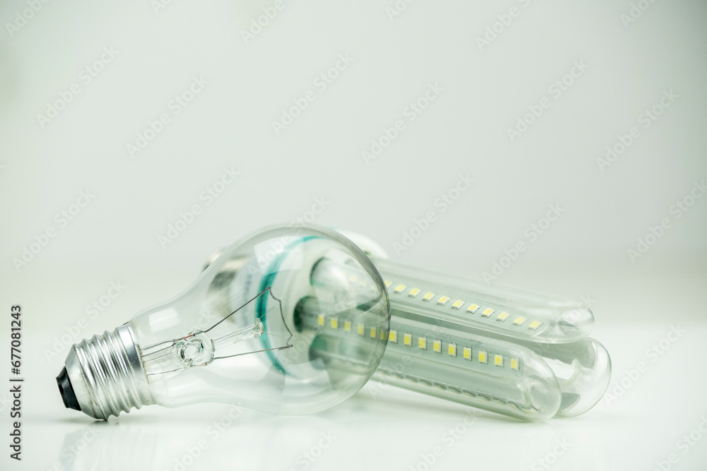 Long LED bulb next to tungsten bulb Long LED bulb next to tungsten bulb