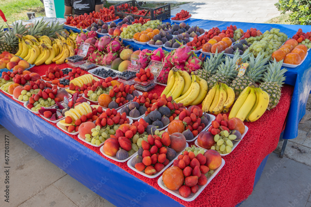 Colorful assorted exotic fruits on market stall