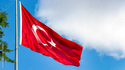 Turkish flag , cloudy sky background. Background image for national holidays and liberation days. Suitable for banner, post, or story with copy area.