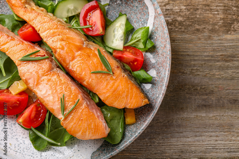 Healthy meal. Tasty grilled salmon with vegetables and spinach on wooden table, top view. Space for text Healthy meal. Tasty grilled salmon with vegetables and spinach on wooden table, top view. Space for text