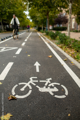 A cyclist rides along the bike path