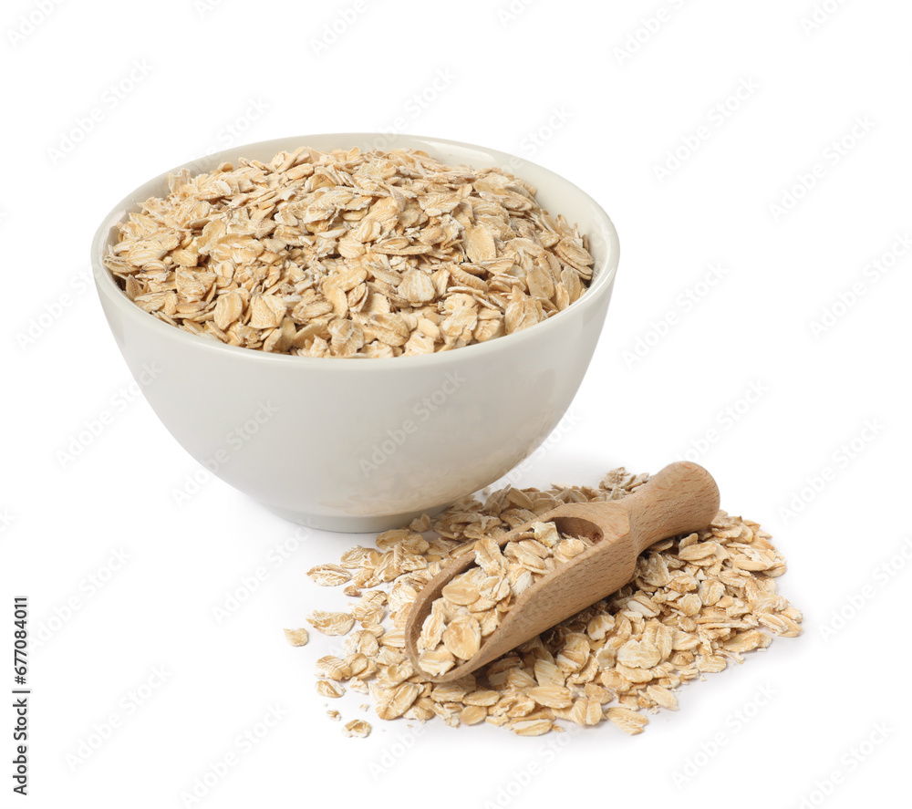 Bowl and scoop with oatmeal isolated on white Bowl and scoop with oatmeal isolated on white