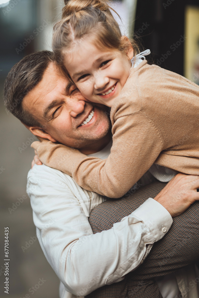 Dad and teenage daughter having fun on a walk in the city. Dad and teenage daughter having fun on a walk in the city.