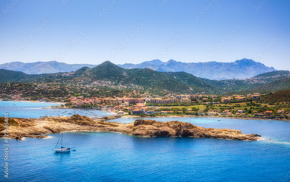 Obraz premium View of the City of L'Ile Rousse on Corsica, France, as Seen from Ile de la Pietra