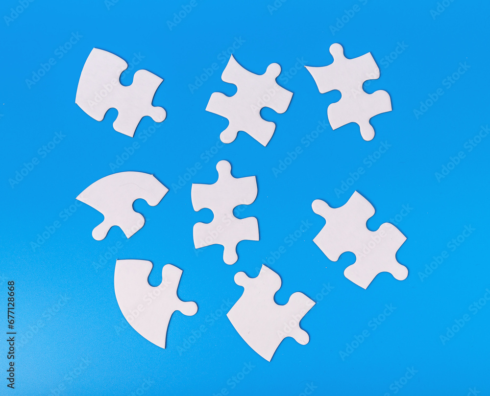 Scattered puzzle pieces in chaos. Jigsaw challenge Scattered puzzle pieces in chaos. Jigsaw challenge