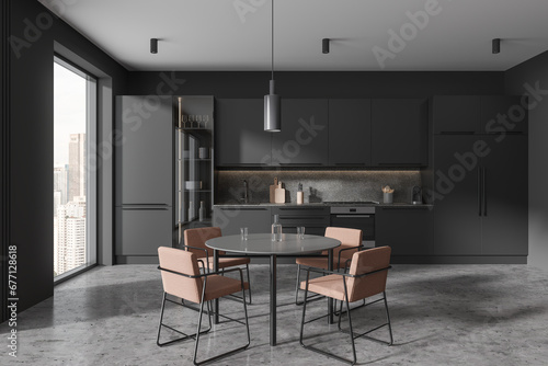Grey home kitchen interior with eating table and chairs, shelves with fridge