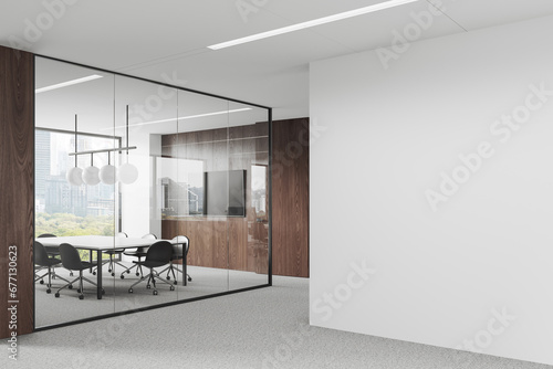 Glass meeting room interior with board and chairs, window and mock up wall photo