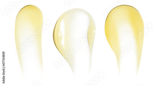 Smears of yellow cream, balm, conditioner with banana, egg or chamomile on an empty background. Isolated.