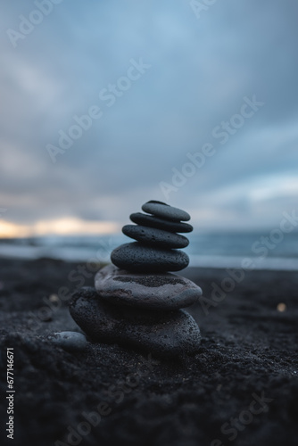 stack of pebble at beach  stones pyramid at cloudy weather