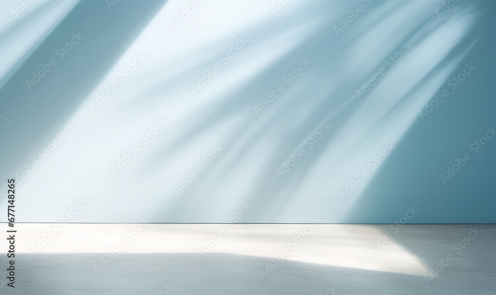 Beautiful original background image of an empty space in blue tones with a play of light and shadow on the wall and floor for design or creative work. Beautiful original background image of an empty space in blue tones with a play of light and shadow on the wall and floor for design or creative work.