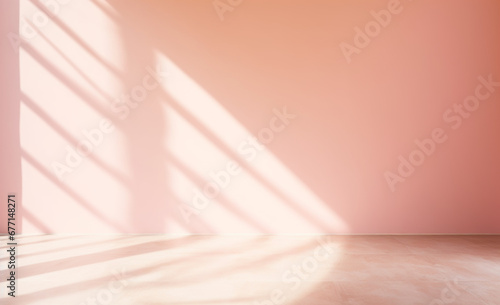 Beautiful original background image of an empty space in pink tones with a play of light and shadow on the wall and floor for design or creative work.