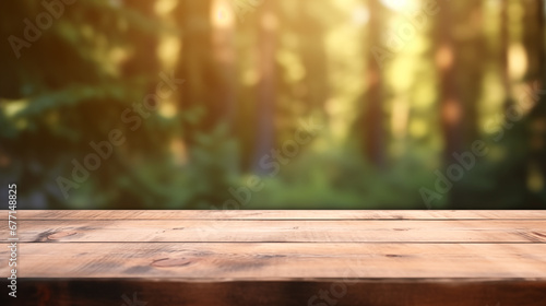 The empty wooden table top with blur background of forest . Exuberant image. soft focus background. copy space.
 photo