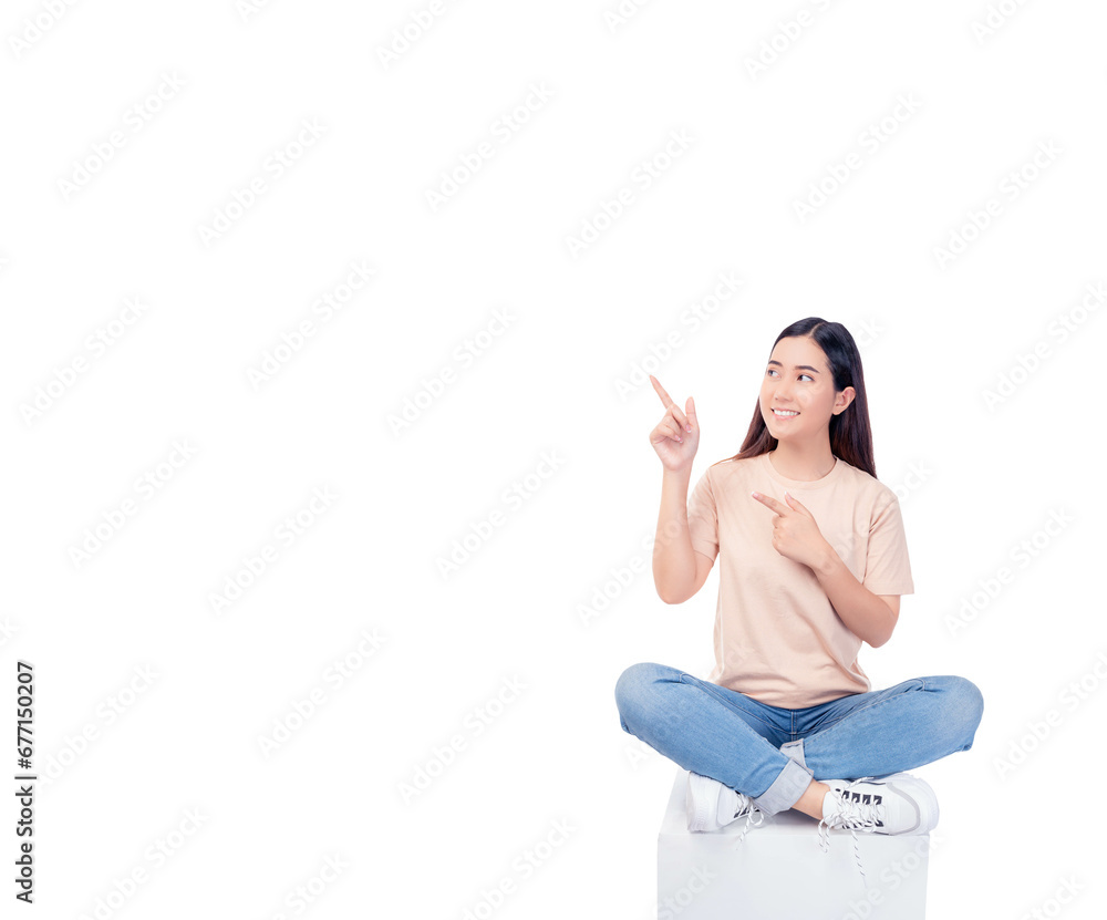 Full body young Asian woman pointing up to copy space and looking at blank space with smile face and happy Pretty girl sit on box chair use for advertising with isolated on white background Full body young Asian woman pointing up to copy space and looking at blank space with smile face and happy Pretty girl sit on box chair use for advertising with isolated on white background