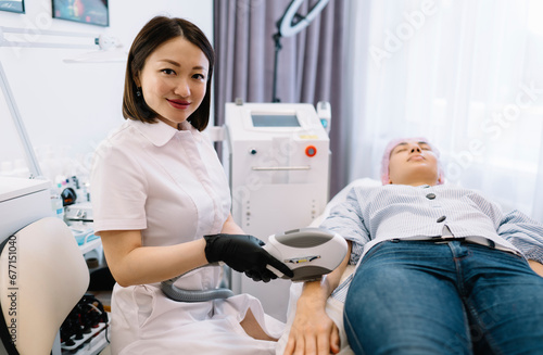 Smiling Asian woman with special equipment in clinic